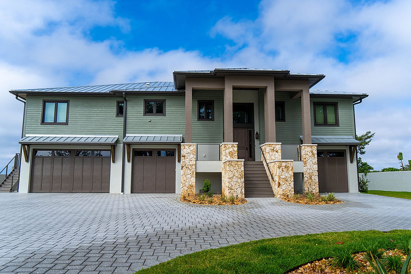 Elevated coastal residence — exterior, built by Great Oaks General Contractors